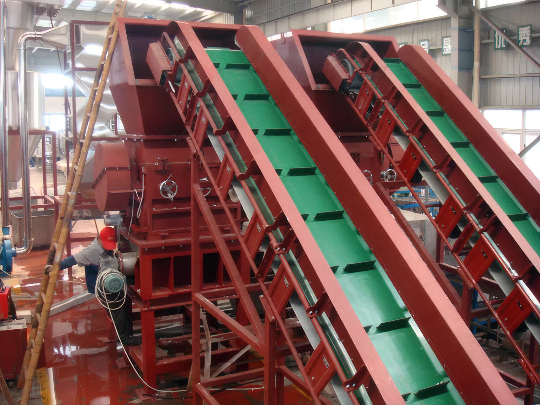 Crusher fed by twin green belt conveyors