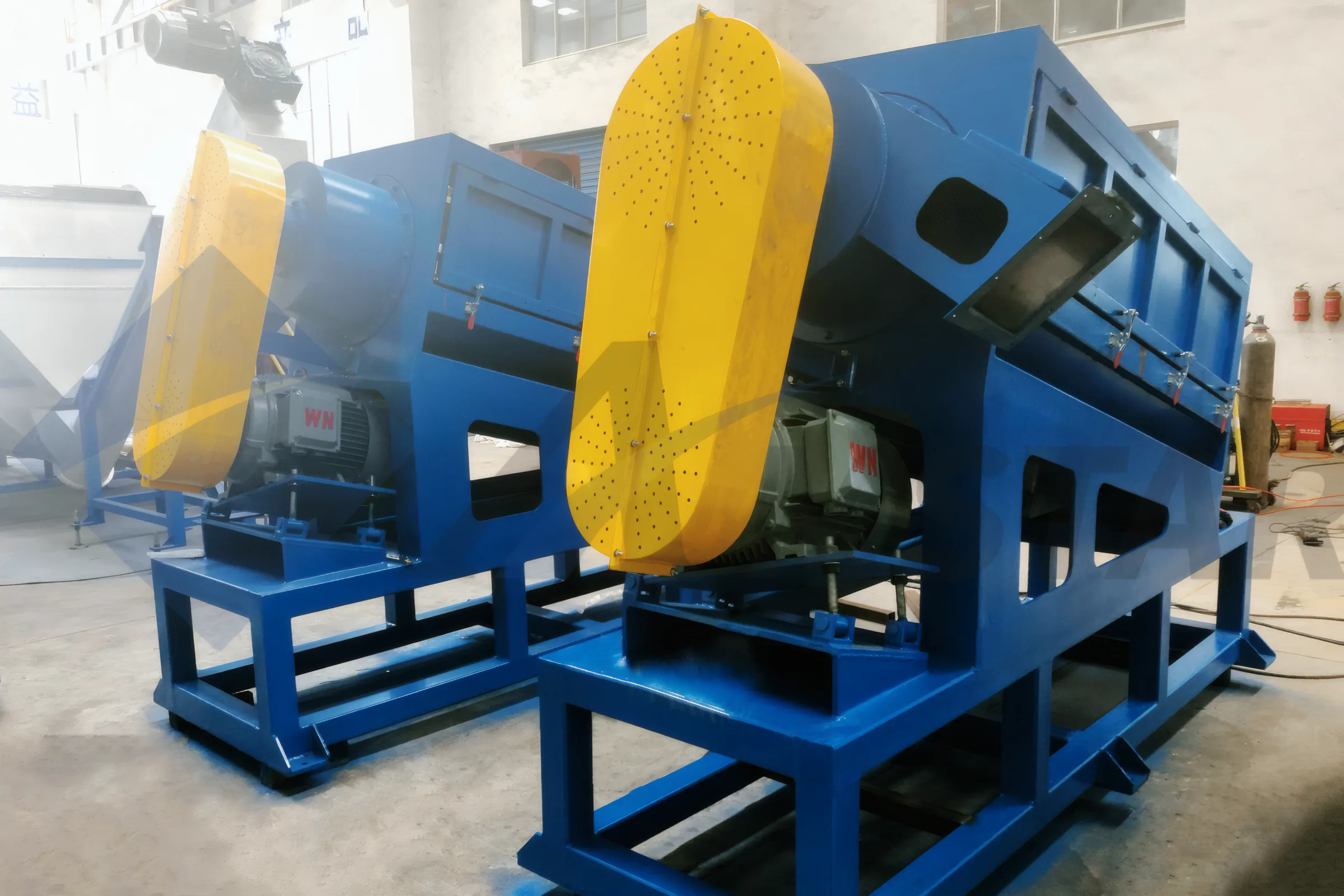 High Speed Friction Washer – inclined housings with yellow belt guards