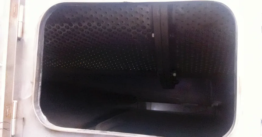 Hot water washer – perforated drum interior