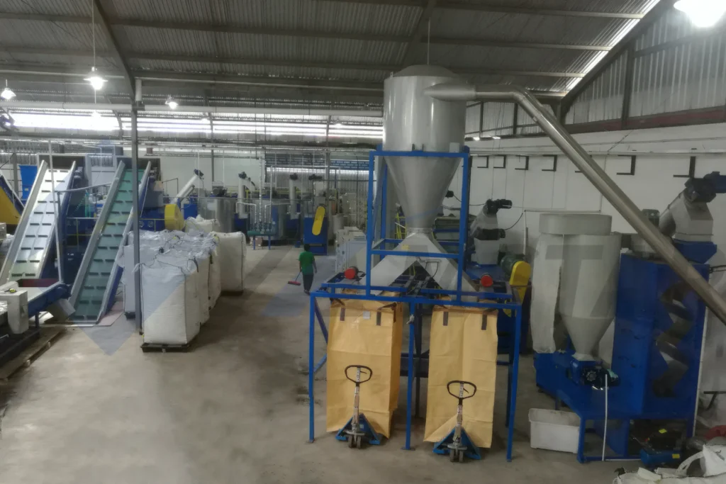 PET Bottle Washing Line – cyclone outlet and collection bags beside conveyors