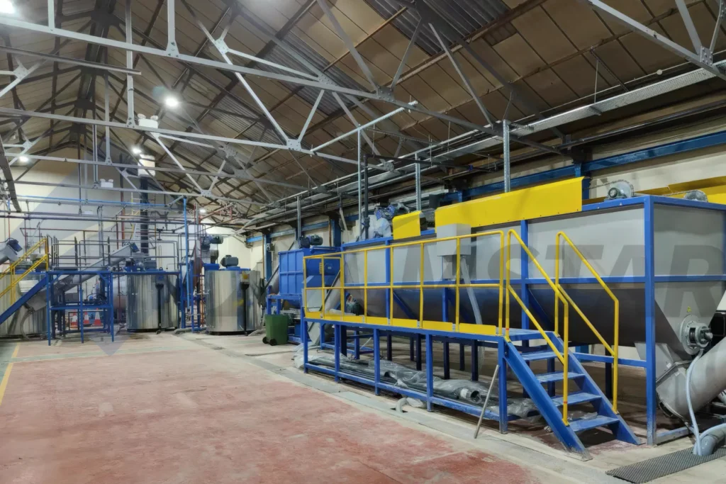 PET Bottle Washing Line – long separation tank and access stairs in the factory