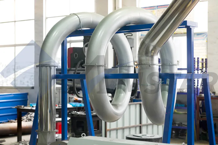 Thermal Dryer – curved stainless drying pipes on the blue support frame