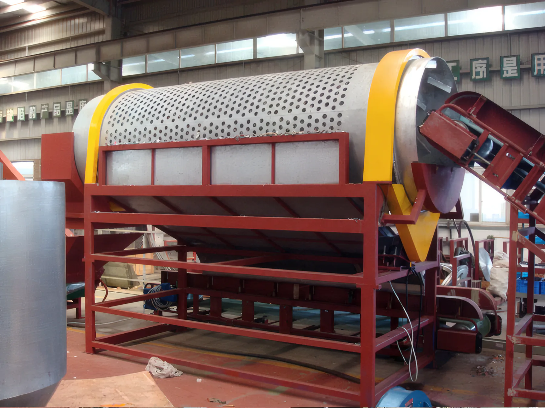 Trommel screening drum and yellow discharge chute, side view