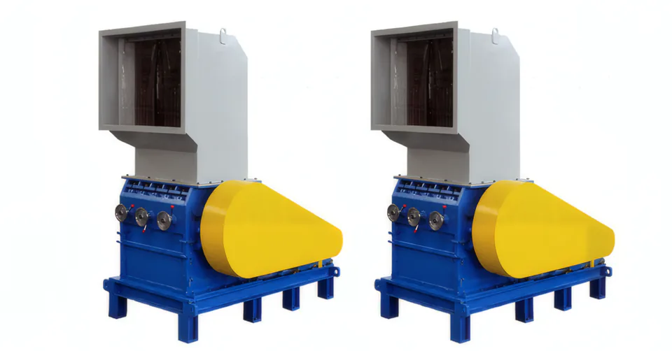 Two plastic granulators for PET flakes with yellow pulley guards