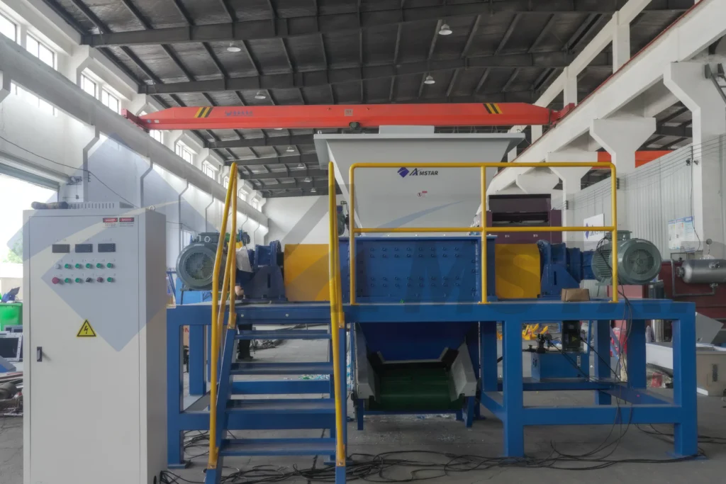 Twin-Shaft Shredder – complete shredding station with control cabinet and stairs