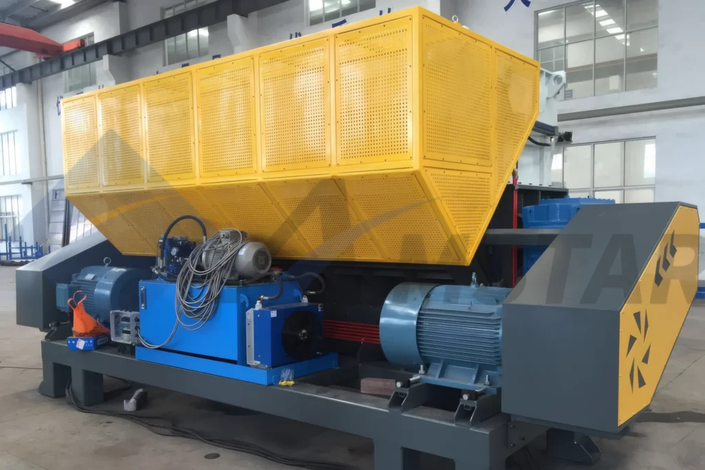 Waste Shredder – wide feed hopper behind yellow safety guarding