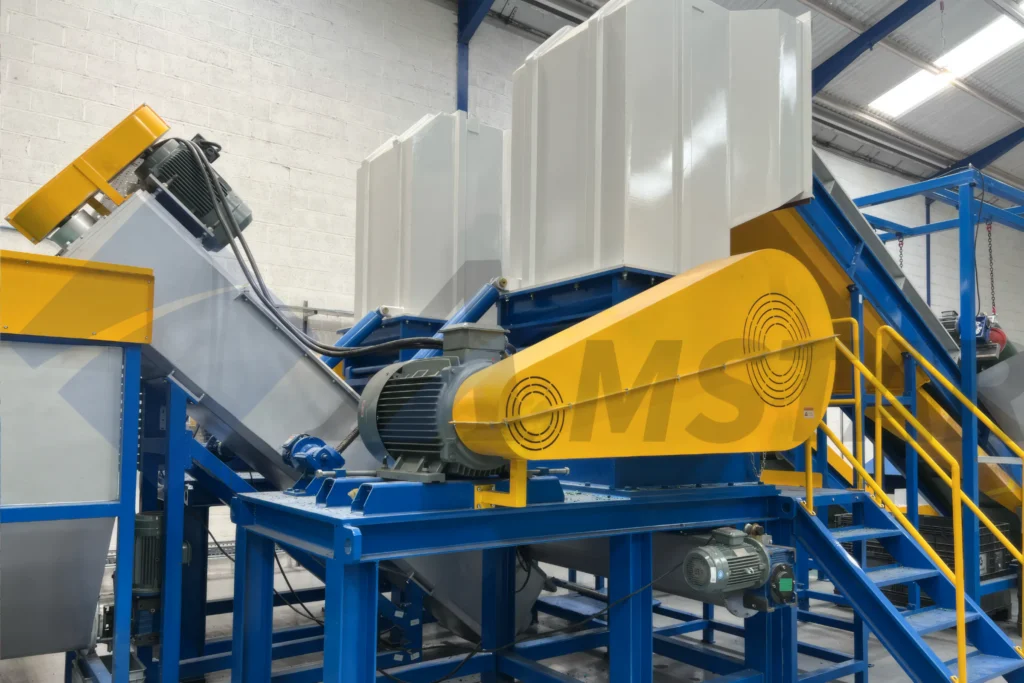 Wet Crusher / Granulator – white feed hopper and yellow guarded drive