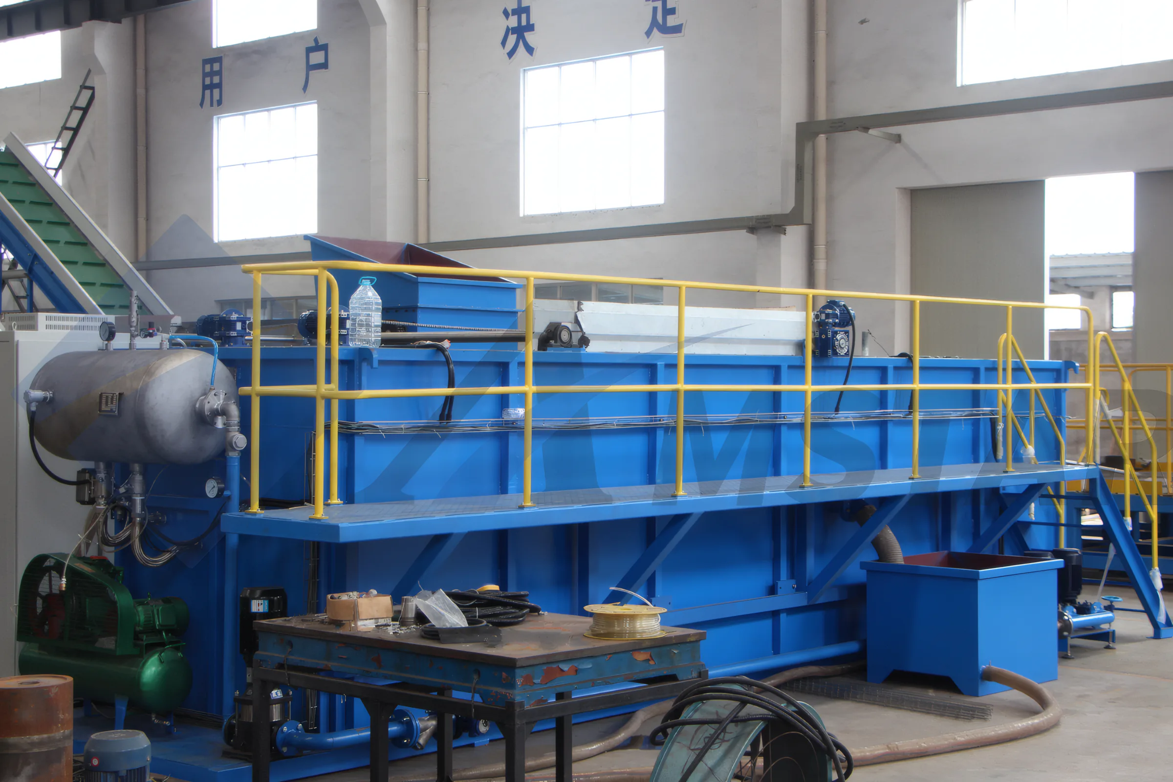 Waste Water Treatment (2019 Model) – blue treatment tank with walkway and yellow guardrails
